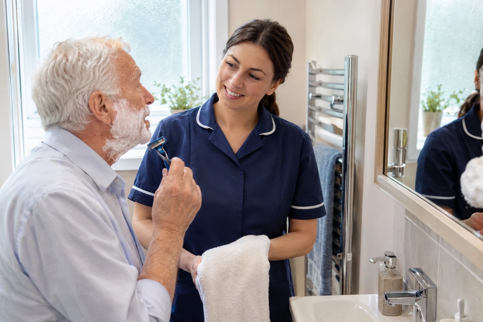 Older woman and carer preparing a meal together in her kitchen during a domiciliary care visit